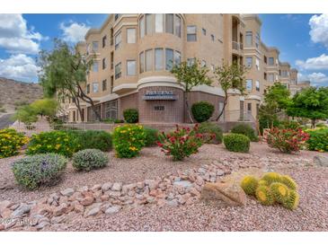 Beautiful condo exterior with well-maintained landscaping and colorful desert plants in a modern community at 9820 N Central Ave # 224, Phoenix, AZ 85020