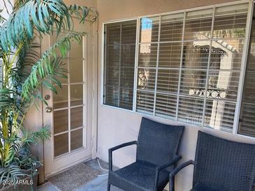 Inviting patio featuring comfortable seating and a sliding door, offering a relaxing outdoor space at 14145 N 92Nd St # 2004, Scottsdale, AZ 85260
