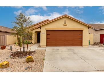 Tan single-story home with a brown two-car garage and desert landscaping at 18102 E El Viejo Desierto --, Gold Canyon, AZ 85118