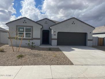 Charming single-story home with a well-maintained front yard and a two-car garage at 1324 S Mullberry St, Florence, AZ 85132