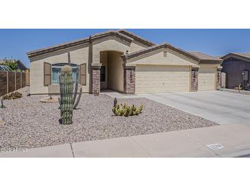 Charming single-story home featuring desert landscaping and a three-car garage at 1726 E Primera Dr, Casa Grande, AZ 85122