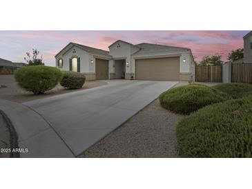 Beautiful single-Gathering home featuring a well-maintained yard and a spacious three-car garage at 35773 N Loemann Dr, San Tan Valley, AZ 85143