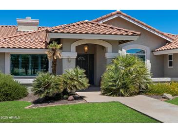 Charming front entrance with red tile roof, desert landscaping, and a cozy, welcoming atmosphere at 3822 E Florian Ave, Mesa, AZ 85206