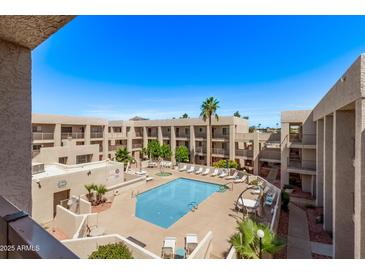 Enjoy the community pool and outdoor lounge area, perfect for relaxing and soaking up the sun at 7474 E Earll Dr # 311, Scottsdale, AZ 85251
