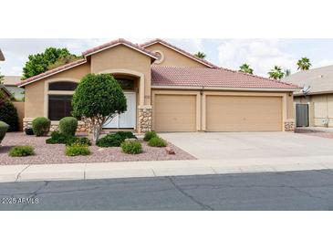 Charming single-story home with a well-maintained front yard and a two-car garage at 1894 E Sagebrush St, Gilbert, AZ 85296