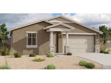 Inviting single-story home featuring a neutral color scheme, a two-car garage, and manicured landscaping at 5511 W Piedmont Rd, Laveen, AZ 85339