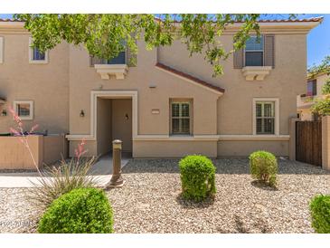 Charming two-story home featuring a well-maintained xeriscaped front yard at 7516 S 31St Pl, Phoenix, AZ 85042
