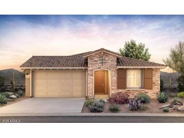 Charming single-story home featuring a stone facade, two-car garage, and well-maintained landscaping at 13530 W Copperleaf Ln, Peoria, AZ 85383