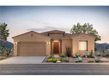 Charming single-story home with desert landscaping and a neutral color palette at sunset at 13768 W Calle De Baca --, Peoria, AZ 85383