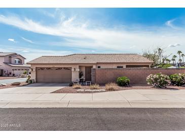 Charming single-story home with a desert-landscaped front yard and a two-car garage in a residential neighborhood at 16654 N 19Th Pl, Phoenix, AZ 85022