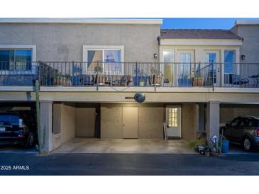 Charming two-story condo with a covered parking area and upper-level balcony perfect for outdoor seating and relaxation at 4431 N 21St Pl, Phoenix, AZ 85016