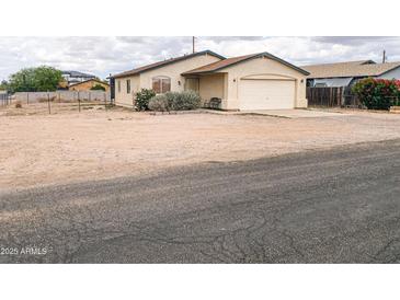 Charming single-story home featuring desert landscaping, attached garage, and quaint curb appeal at 5122 E Shadow Ln, San Tan Valley, AZ 85140