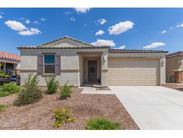 Charming single-story home featuring desert landscaping and a two-car garage at 18492 E Donato Dr, Gold Canyon, AZ 85118