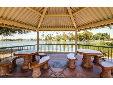 Picturesque gazebo overlooking a serene lake, perfect for relaxation and enjoying scenic views at 10330 W Thunderbird W Blvd # B103, Sun City, AZ 85351
