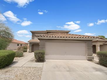 Charming two-story home featuring a tile roof and a spacious two-car garage at 1078 E Poncho Ln, San Tan Valley, AZ 85143