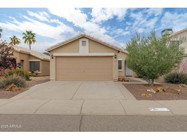 Charming single-story home featuring a desert landscape, and a two-car garage at 2112 E Donald Dr, Phoenix, AZ 85024