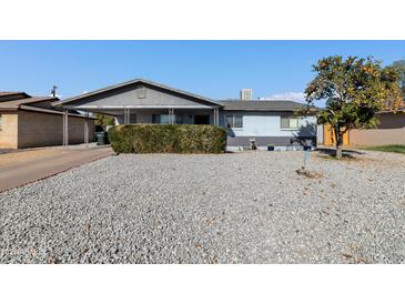 Charming single-story home with rock landscaping and a mature citrus tree in the front yard at 3422 W Poinsettia Dr, Phoenix, AZ 85029
