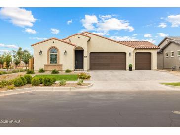 Charming single-story home featuring a stucco exterior, tile roof, and a well-manicured front yard at 9612 E Rainbow Ave, Mesa, AZ 85212