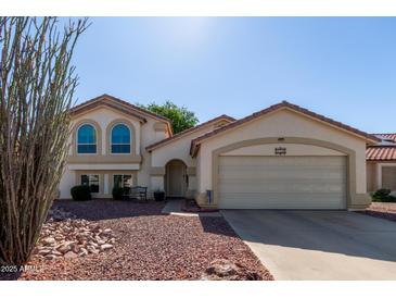 Charming single-Gathering home boasting stucco siding, tile roof, and a well-maintained front yard at 150 N Nielson St, Gilbert, AZ 85234