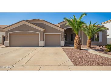 Charming single-story home featuring a spacious three-car garage and desert landscaping at 2945 E Clifton Ave, Gilbert, AZ 85295