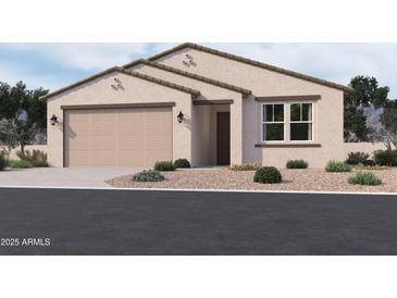 Charming single-story home showcasing desert landscaping and an attached two-car garage at 9536 W Parkway Dr, Tolleson, AZ 85353