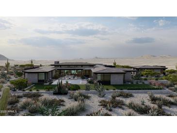 Modern home featuring a desert landscape, pool, and lounge area with mountain views in the background at 0 N 128Th St, Scottsdale, AZ 85255