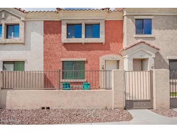 Charming townhouse featuring a private patio with seating, perfect for enjoying the Arizona weather at 1950 N Center St # 115, Mesa, AZ 85201