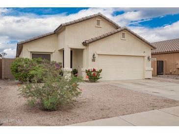 Lovely single-story home with desert landscaping and an attached two-car garage at 1170 E Jardin Dr, Casa Grande, AZ 85122