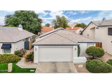 Charming single-story home features a well-maintained yard, a two-car garage, and a neutral color palette at 15815 N 4Th Dr, Phoenix, AZ 85023