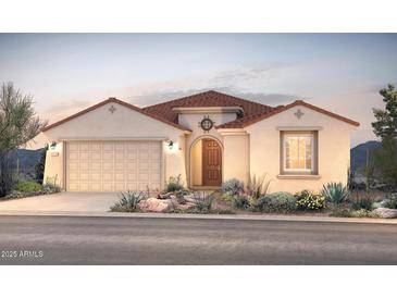 Charming single-story home featuring a tile roof, desert landscaping, and a welcoming arched entryway at 17625 W Rancho Dr, Litchfield Park, AZ 85340
