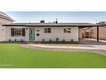 Charming single-story home with a well-manicured lawn and inviting curb appeal at 2111 N Van Ness Ave, Tempe, AZ 85288