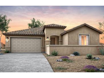 Charming single-story home with a neutral color scheme, tile roof, well maintained desert landscaping, and a two car garage at 42945 W Palo Abeto Dr, Maricopa, AZ 85138