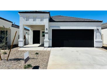 Charming single-story home featuring a modern, neutral color palette and a two-car garage at 5084 E Umber Rd, San Tan Valley, AZ 85143