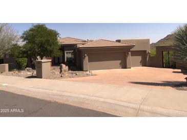 Charming, desert-landscaped home with a private gate and two-car garage, perfect for southwestern living at 15135 E Sundown Dr, Fountain Hills, AZ 85268