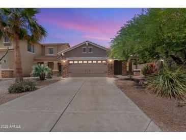 Charming two-story home with a spacious driveway and desert landscaping at 35624 N Zachary Rd, San Tan Valley, AZ 85144