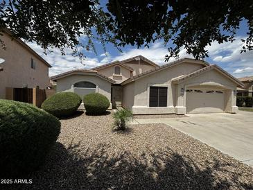 Charming single-story home features a two car garage and low maintenance desert landscaping at 8006 W Gibson Ln, Phoenix, AZ 85043