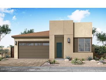 Modern single-story home featuring a stylish facade, a two-car garage, and desert landscaping at 2168 E Mill Rd, San Tan Valley, AZ 85140