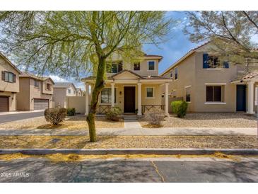 Charming two-story home with a cozy front porch and well-maintained landscaping at 6907 S 8Th Dr, Phoenix, AZ 85041