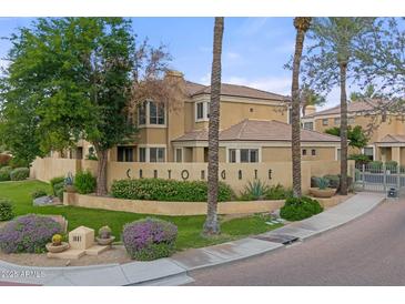 A charming home featuring desert landscaping, a tile roof, and neutral tones in a gated community at 7887 N 16Th St # 226, Phoenix, AZ 85020