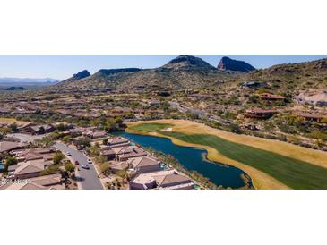 Stunning aerial view of a luxurious home nestled amidst a golf course and mountains in a desert landscape at 9432 N Longfeather --, Fountain Hills, AZ 85268