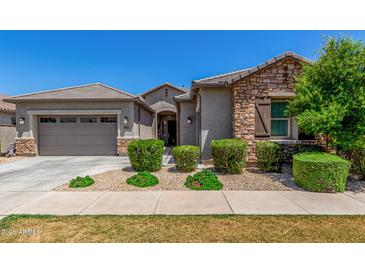 Charming single-story home with manicured landscaping and a two-car garage at 9922 E Thunderbolt Ave, Mesa, AZ 85212