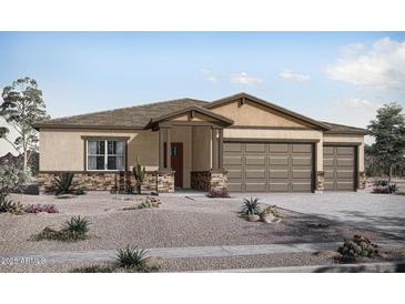 Charming single-story home featuring a three-car garage and low-maintenance desert landscaping at 22699 E Happy Rd, Queen Creek, AZ 85142
