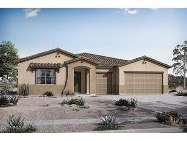 Charming single story home displaying neutral toned stucco, tile roof, covered porch, three car garage and desert landscaping at 22705 E Happy Rd, Queen Creek, AZ 85142