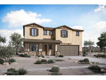 Two story home boasts a neutral color palette, two-car garage, and desert landscaping for low maintenance at 23039 E Watford Dr, Queen Creek, AZ 85142
