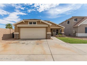 Charming single-story home featuring a two-car garage and well-manicured lawn at 2341 S Gordon --, Mesa, AZ 85209