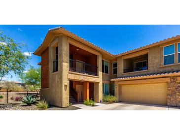 Charming townhome with two stories, stucco, beautiful stone accents, private balconies, and a two car garage at 2425 W Bronco Butte Trl # 2011, Phoenix, AZ 85085