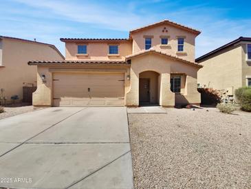 Charming two-story home with a two-car garage and well-maintained desert landscaping at 43530 W Eddie Way, Maricopa, AZ 85138