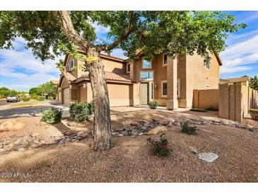 Inviting two-story home with a well-manicured front yard, decorative rock, and desert landscaping at 462 W Myrtle Dr, Chandler, AZ 85248
