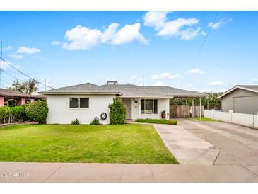 Charming single-story home with well-manicured lawn and covered carport at 508 S Pasadena --, Mesa, AZ 85210