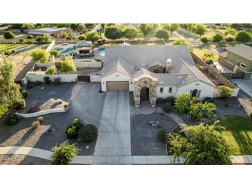 Stunning aerial view of home featuring lush landscaping, stone accents, and a charming courtyard entrance at 6286 S Reseda St, Gilbert, AZ 85298